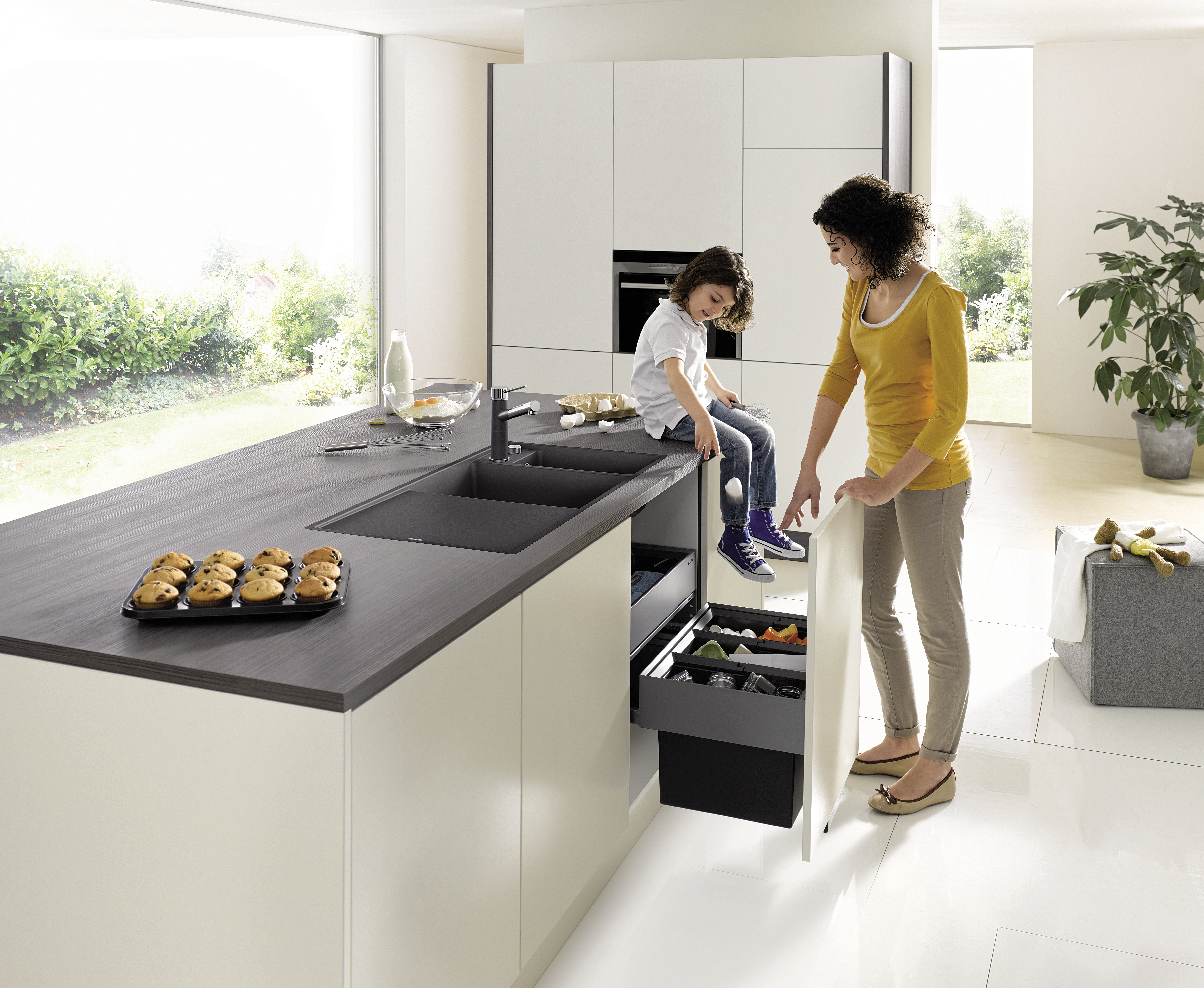 mother and daughter at cleaning up their kitchen island